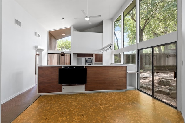1703 E Barbara St, Tyler, TX 75701 - kitchen with fridge, high vaulted ceiling, a ceiling fan, healthy amount of natural light, and modern cabinets
