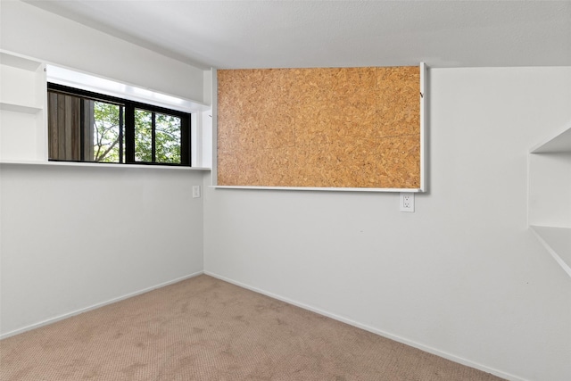 1703 E Barbara St, Tyler, TX 75701 - empty room featuring carpet floors and baseboards
