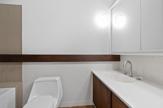 1703 E Barbara St, Tyler, TX 75701 - bathroom with vanity, toilet, and a bathtub