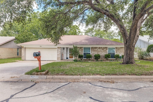 2505 Blue Quail Dr, Arlington, TX 76017 - ranch-style house with brick siding, an attached garage, a front lawn, and concrete driveway