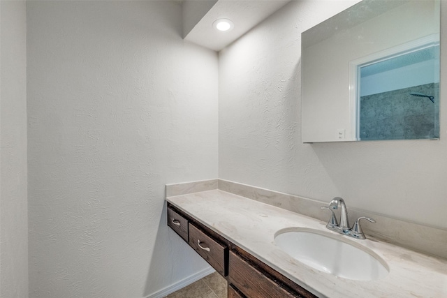 2505 Blue Quail Dr, Arlington, TX 76017 - bathroom featuring vanity and a textured wall