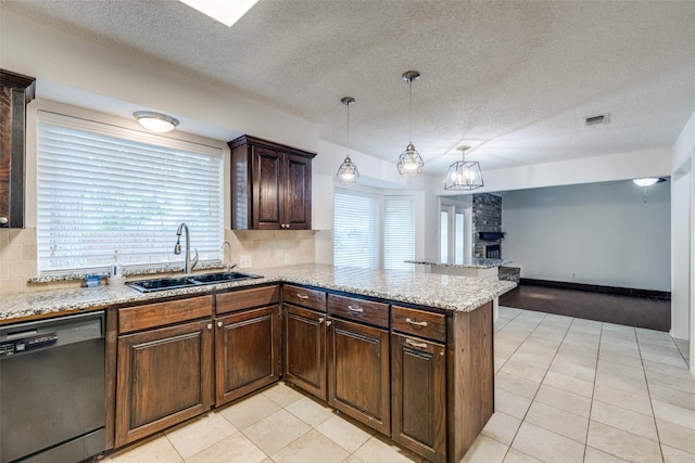 2505 Blue Quail Dr, Arlington, TX 76017 - kitchen with dishwasher, a sink, a peninsula, light tile patterned floors, and a large fireplace