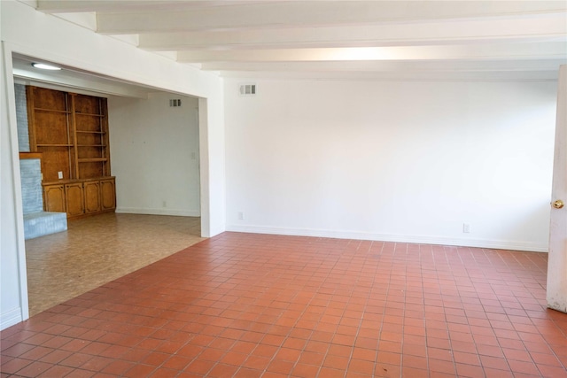 2206 Culbertson, Paris, TX 75460 - spare room with baseboards, beam ceiling, and built in shelves