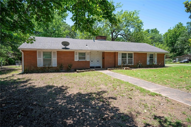 2206 Culbertson, Paris, TX 75460 - ranch-style house with a front lawn, brick siding, a chimney, and roof with shingles