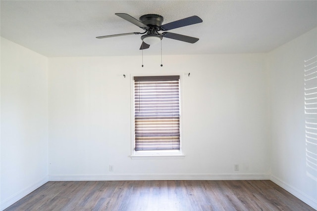 2206 Culbertson, Paris, TX 75460 - empty room with wood finished floors, a ceiling fan, and baseboards