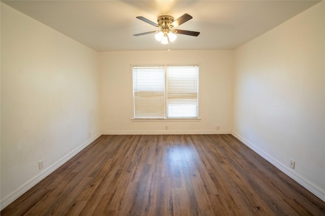 2206 Culbertson, Paris, TX 75460 - spare room featuring baseboards, a ceiling fan, and dark wood-type flooring