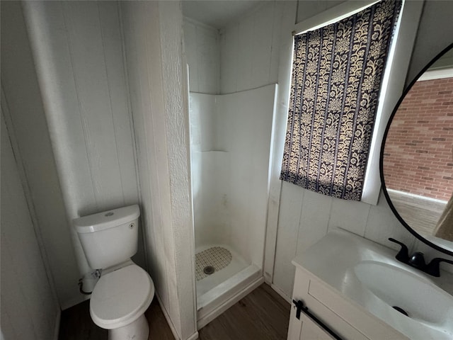 4312 Wheeler St, Bellmead, TX 76705 - bathroom with wood finished floors, vanity, toilet, and a stall shower