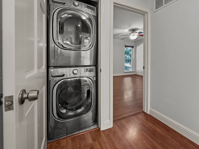 2727 Shelby Ave Unit X, Dallas, TX 75219 - washroom featuring stacked washer / drying machine, wood finished floors, baseboards, and a ceiling fan