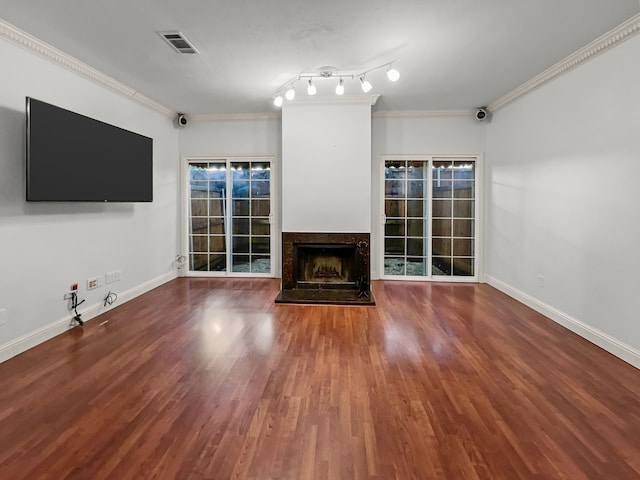 2727 Shelby Ave Unit X, Dallas, TX 75219 - unfurnished living room featuring wood finished floors, ornamental molding, a premium fireplace, and baseboards