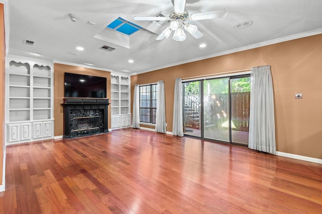 3410 Timbermill Rd, Waco, TX 76710 - unfurnished living room with crown molding, a fireplace, a ceiling fan, wood finished floors, and baseboards