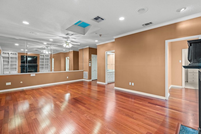 3410 Timbermill Rd, Waco, TX 76710 - unfurnished living room featuring a ceiling fan, crown molding, light wood finished floors, baseboards, and recessed lighting