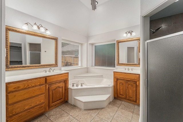 2005 Timber Cove Ct, Weatherford, TX 76087 - full bath featuring a stall shower, two vanities, a garden tub, tile patterned flooring, and lofted ceiling