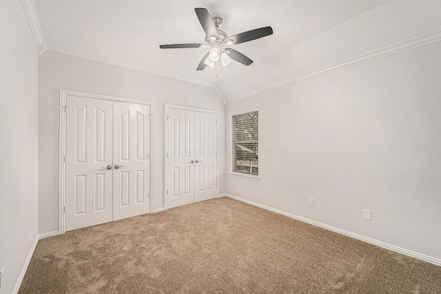 2005 Timber Cove Ct, Weatherford, TX 76087 - unfurnished bedroom featuring crown molding, two closets, carpet flooring, baseboards, and ceiling fan
