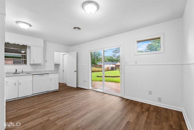 2541 Mecom Dr, Shreveport, LA 71104 - kitchen with dishwasher, light countertops, baseboards, dark wood-style flooring, and white cabinetry
