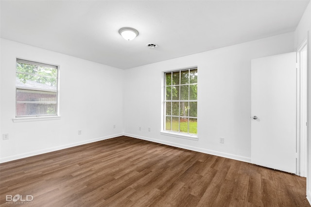 2541 Mecom Dr, Shreveport, LA 71104 - spare room featuring dark wood finished floors and baseboards