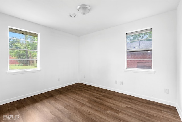 2541 Mecom Dr, Shreveport, LA 71104 - spare room with dark wood finished floors and baseboards