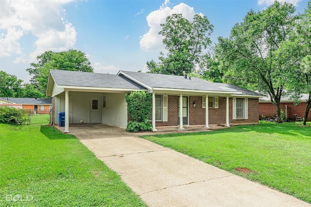 2541 Mecom Dr, Shreveport, LA 71104 - single story home with driveway, an attached carport, brick siding, a porch, and board and batten siding