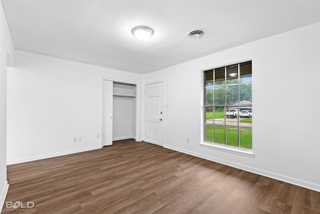 2541 Mecom Dr, Shreveport, LA 71104 - unfurnished bedroom with wood finished floors and baseboards