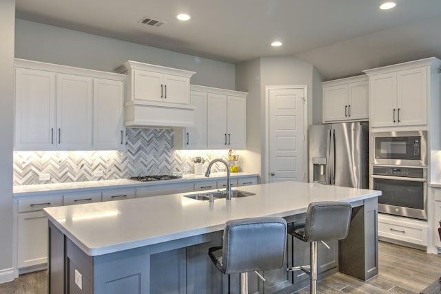 3609 Honey Suckle Ln, Little Elm, TX 75068 - kitchen featuring appliances with stainless steel finishes, a sink, backsplash, recessed lighting, and light countertops