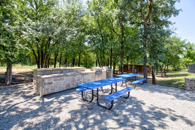 3609 Honey Suckle Ln, Little Elm, TX 75068 - view of patio with view of wooded area