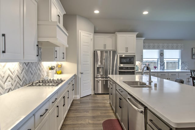 3609 Honey Suckle Ln, Little Elm, TX 75068 - kitchen with appliances with stainless steel finishes, a sink, recessed lighting, dark wood-style floors, and light countertops