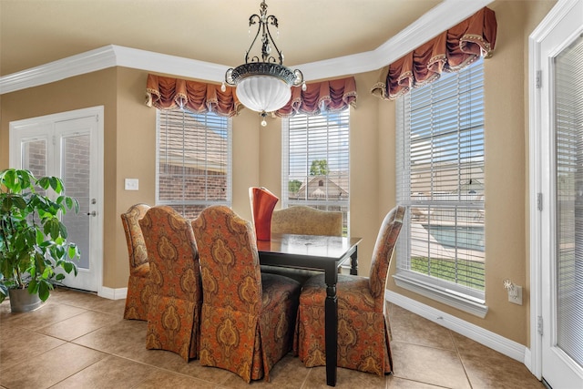 1300 Enchanted Rock Cir, Waco, TX 76712 - dining room featuring tile patterned flooring, baseboards, and ornamental molding