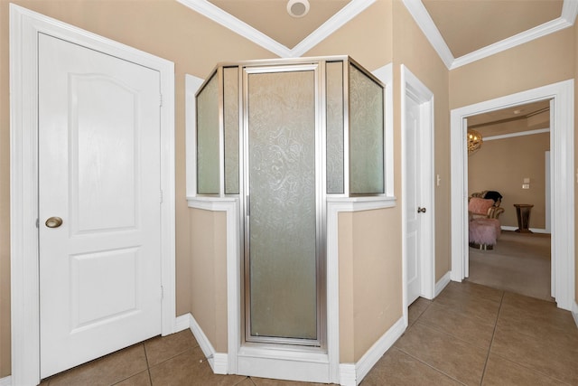 1300 Enchanted Rock Cir, Waco, TX 76712 - bathroom featuring tile patterned floors, a stall shower, ornamental molding, and baseboards