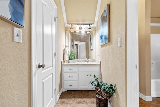 1300 Enchanted Rock Cir, Waco, TX 76712 - full bath with a textured wall, vanity, tile patterned flooring, and baseboards