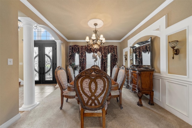 1300 Enchanted Rock Cir, Waco, TX 76712 - dining room featuring decorative columns, a chandelier, light carpet, french doors, and arched walkways
