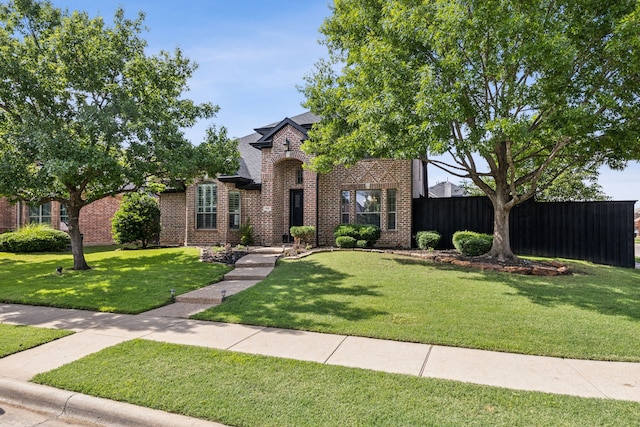 2398 April Sound Ln, Frisco, TX 75033 - view of front of house featuring brick siding and a shingled roof