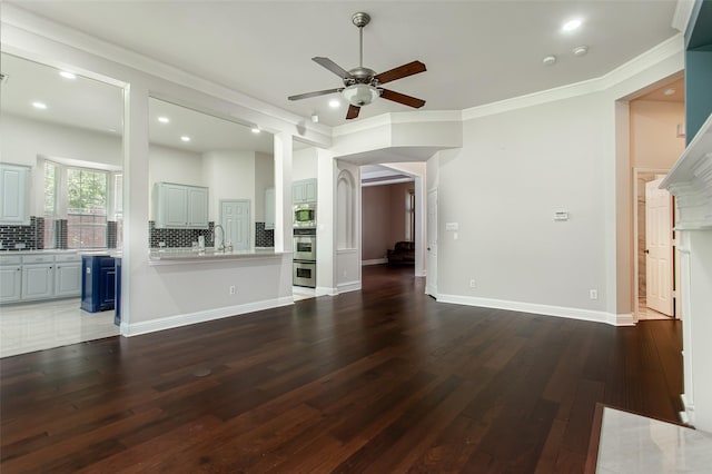 3700 Wagon Wheel Ct, Richardson, TX 75082 - unfurnished living room featuring a ceiling fan, dark wood-style flooring, crown molding, and recessed lighting