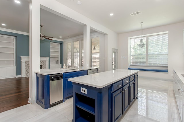 3700 Wagon Wheel Ct, Richardson, TX 75082 - kitchen with blue cabinets, a ceiling fan, built in features, a kitchen island, and recessed lighting