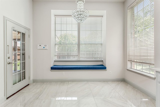 3700 Wagon Wheel Ct, Richardson, TX 75082 - unfurnished dining area featuring a chandelier and baseboards