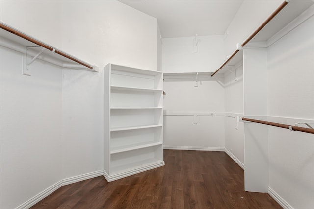3700 Wagon Wheel Ct, Richardson, TX 75082 - walk in closet with dark wood-style flooring