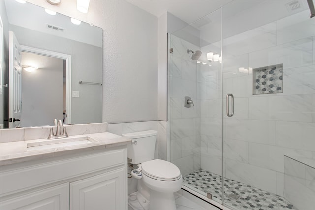3700 Wagon Wheel Ct, Richardson, TX 75082 - full bathroom with a stall shower, vanity, and marble look tiles