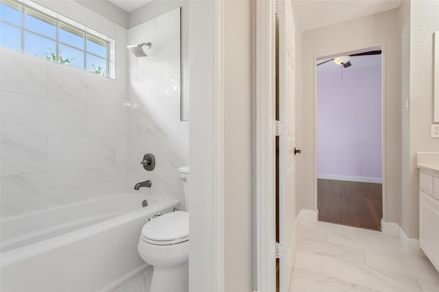 3700 Wagon Wheel Ct, Richardson, TX 75082 - full bathroom featuring tub / shower combination, vanity, a ceiling fan, and marble look tiles