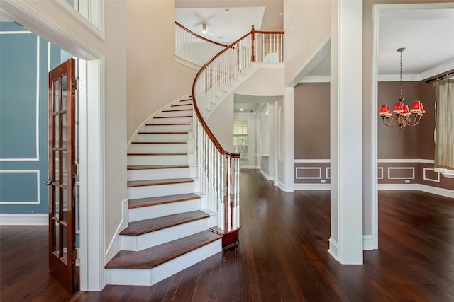 3700 Wagon Wheel Ct, Richardson, TX 75082 - stairs with a chandelier, hardwood / wood-style flooring, and a high ceiling