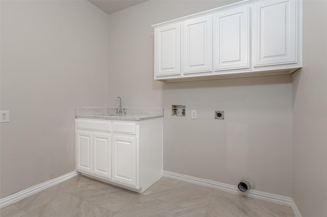 3700 Wagon Wheel Ct, Richardson, TX 75082 - laundry room with washer hookup, cabinet space, electric dryer hookup, and light marble finish flooring