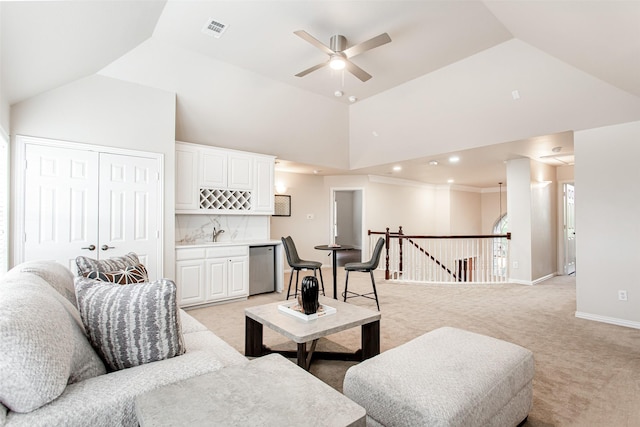 3700 Wagon Wheel Ct, Richardson, TX 75082 - living area featuring wet bar, light carpet, high vaulted ceiling, and ceiling fan