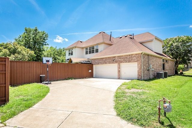 3700 Wagon Wheel Ct, Richardson, TX 75082 - view of side of home with brick siding, a garage, concrete driveway, and roof with shingles