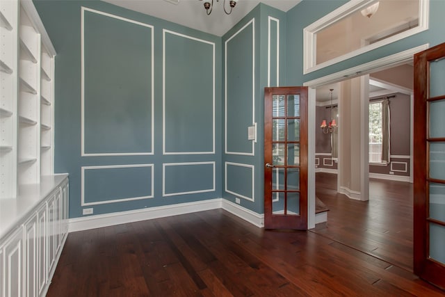 3700 Wagon Wheel Ct, Richardson, TX 75082 - empty room with dark wood-type flooring and a decorative wall