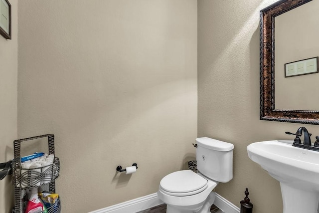 4323 Cherry Ln, Melissa, TX 75454 - bathroom with toilet, baseboards, and a sink