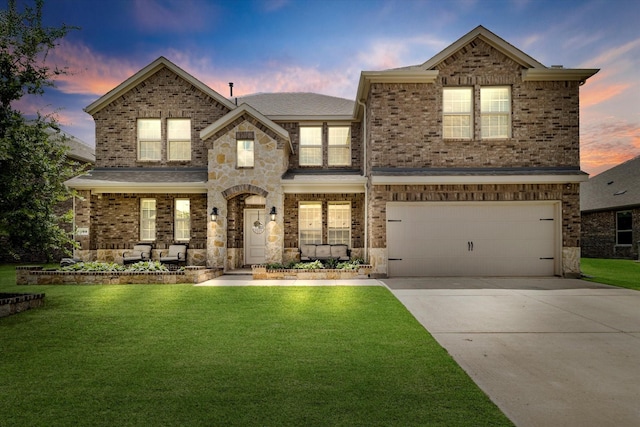 2709 Madera Canyon Rd, Aubrey, TX 76227 - view of front of house with a yard, driveway, brick siding, and a garage