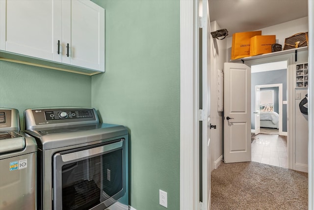 2709 Madera Canyon Rd, Aubrey, TX 76227 - laundry area featuring cabinet space, independent washer and dryer, carpet, and baseboards