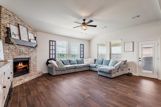 2709 Madera Canyon Rd, Aubrey, TX 76227 - living area with ceiling fan, dark wood-type flooring, lofted ceiling, a fireplace, and baseboards