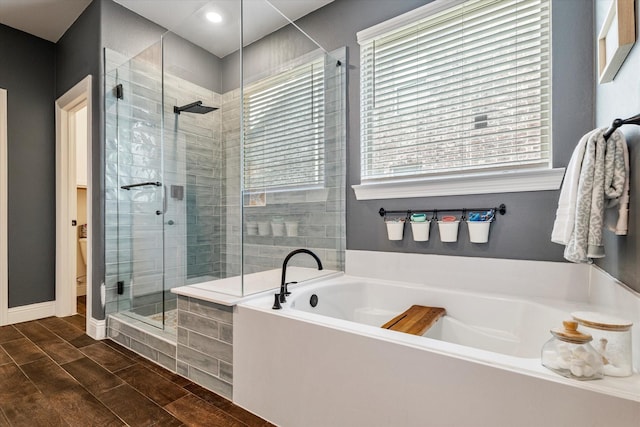 2709 Madera Canyon Rd, Aubrey, TX 76227 - bathroom featuring a garden tub, a stall shower, wood tiled floors, recessed lighting, and toilet