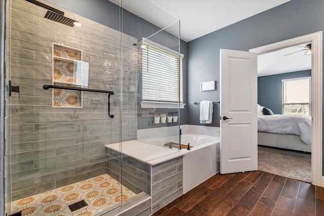 2709 Madera Canyon Rd, Aubrey, TX 76227 - bathroom with ensuite bath, a bath, wood finished floors, and a stall shower