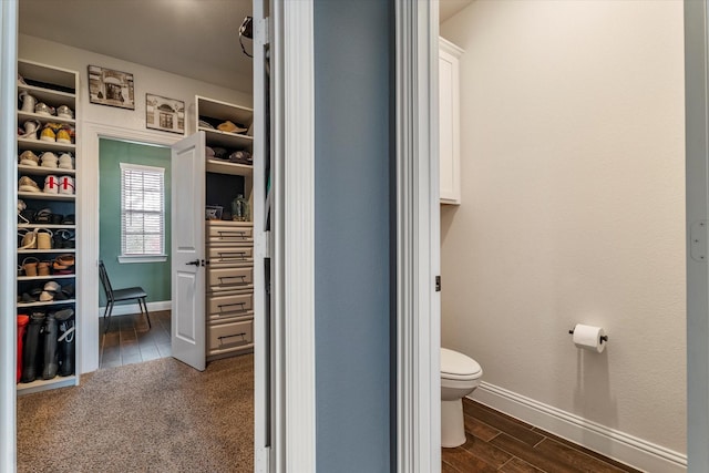 2709 Madera Canyon Rd, Aubrey, TX 76227 - bathroom with toilet, baseboards, and wood finished floors