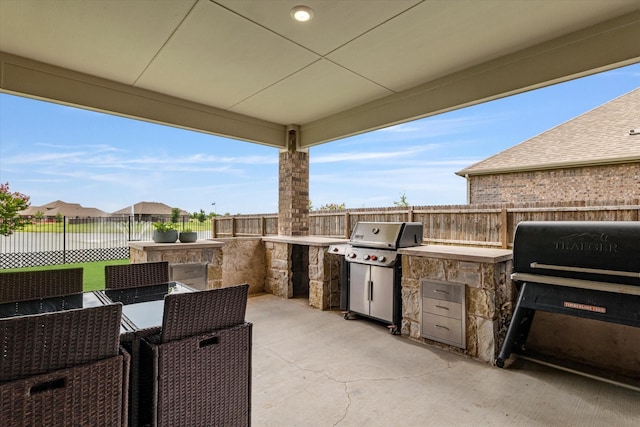 2709 Madera Canyon Rd, Aubrey, TX 76227 - fenced backyard featuring a patio and outdoor dining space