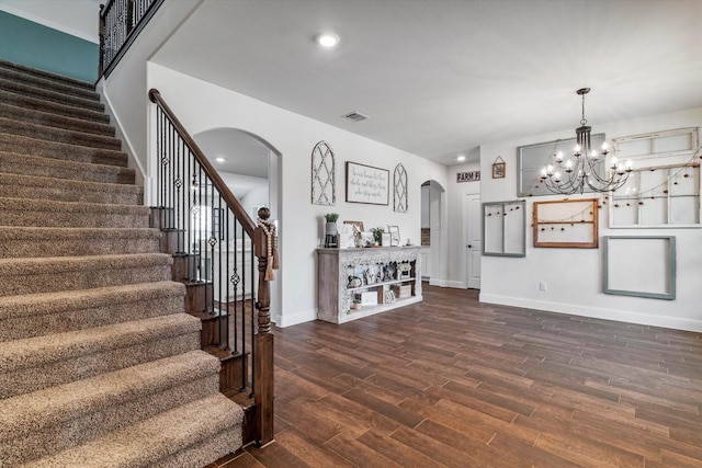 2709 Madera Canyon Rd, Aubrey, TX 76227 - staircase featuring arched walkways, wood finished floors, baseboards, a chandelier, and recessed lighting